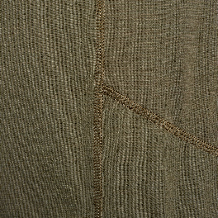Close-up of a textile showing olive green fabric with detailed double stitching and subtle texture variations