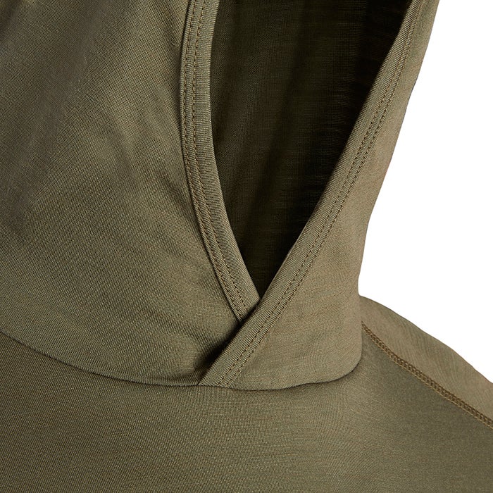 Close-up of a soft olive-green hooded sweatshirt showcasing its double-stitched seams and subtle texture