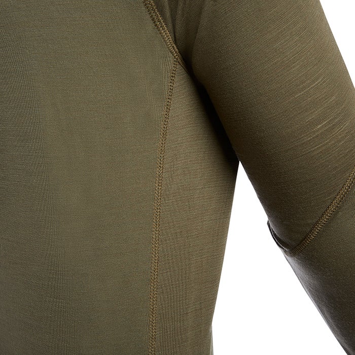 Close-up of a textured olive-green long-sleeved shirt showing detailed stitching and subtle color variations in the fabric