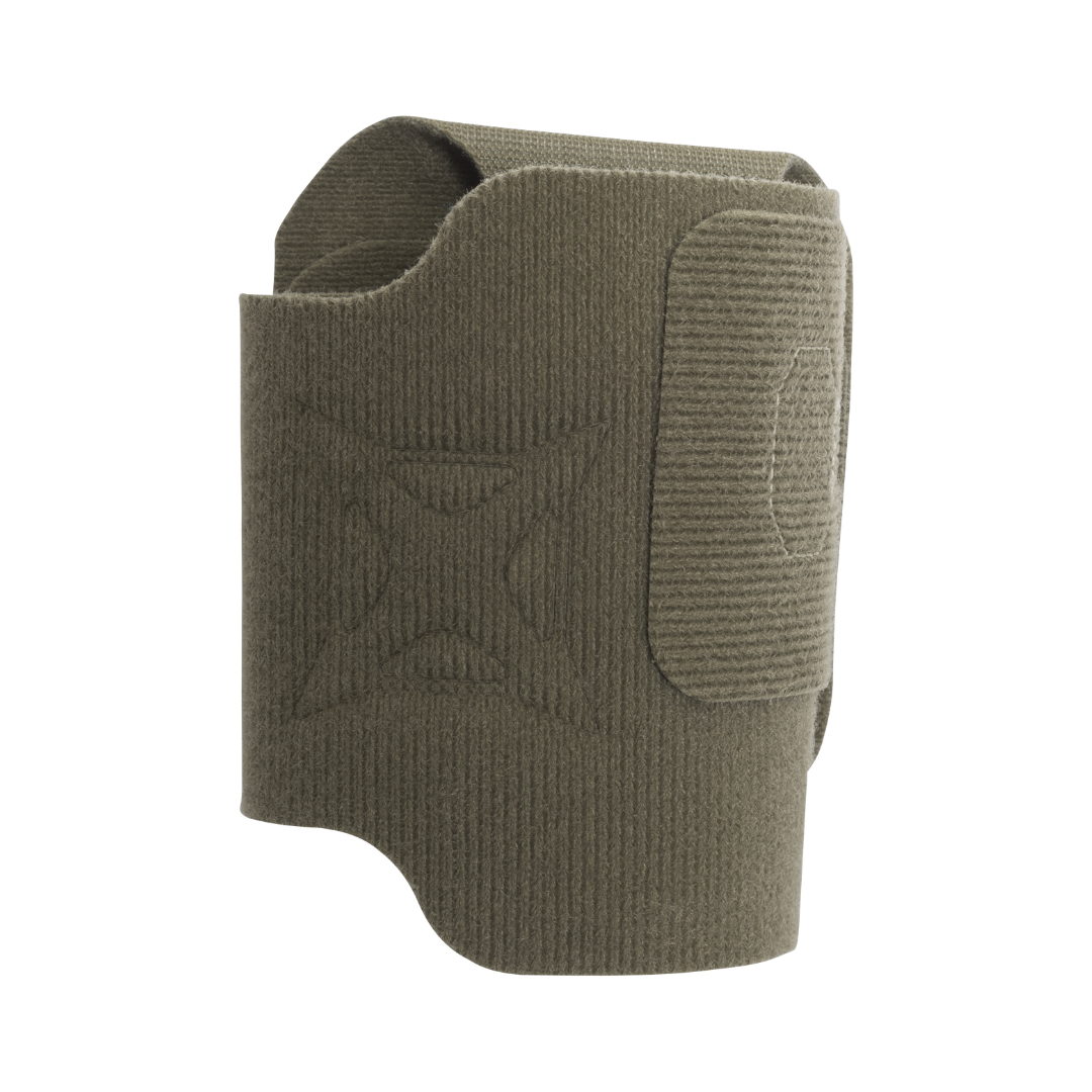 Product shot of a dark olive green fabric pistol grip sleeve with embossed cross and logo detail featuring a ribbed texture and velcro closure