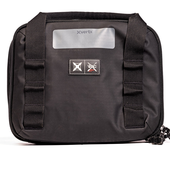 Product shot of a black Vertrx VIPAC Gear Bag featuring a reflective gray label and black nylon straps with red logo details