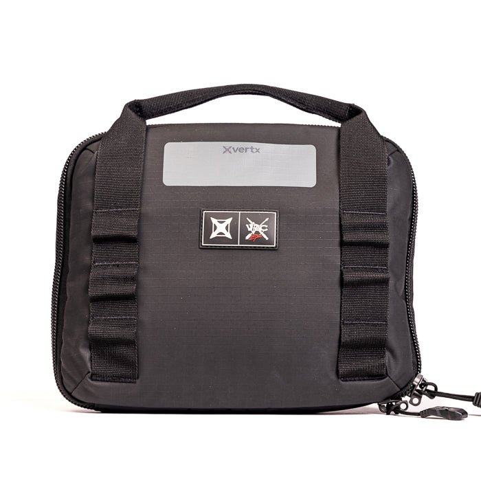 Product shot of a black Xvertx carrying case featuring a grey label, black webbing accents, and a small logo patch against a white background