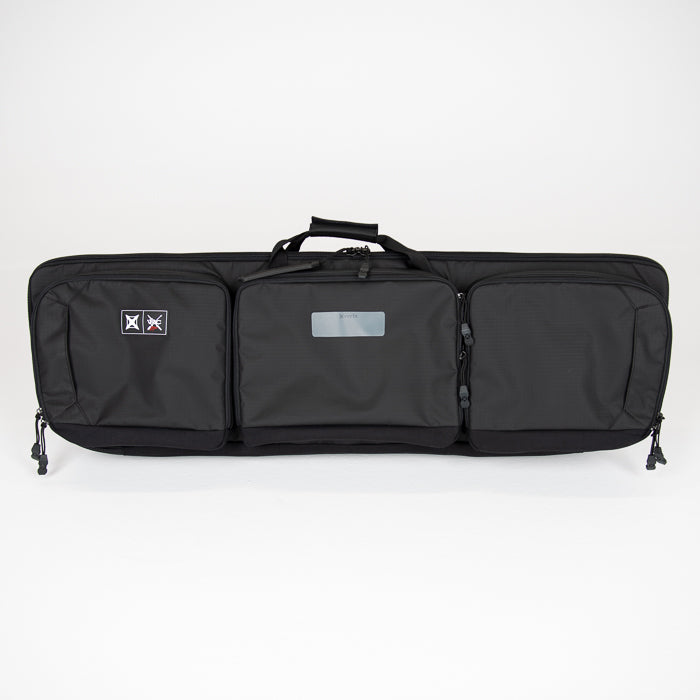 Product shot of a black Boretex rifle case with multiple zippered compartments a handle and a small logo patch showcasing its durable construction and tactical design