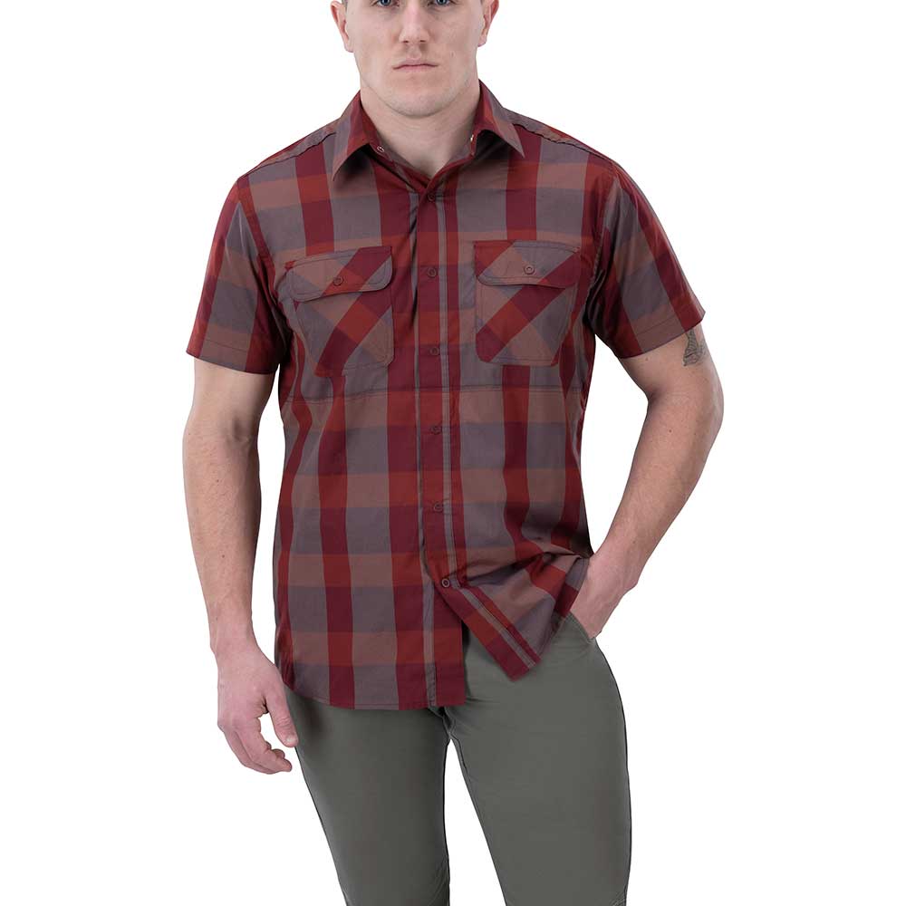 Product shot of a man wearing a red and gray plaid short-sleeved button-down shirt with two chest pockets and olive green pants against a white background