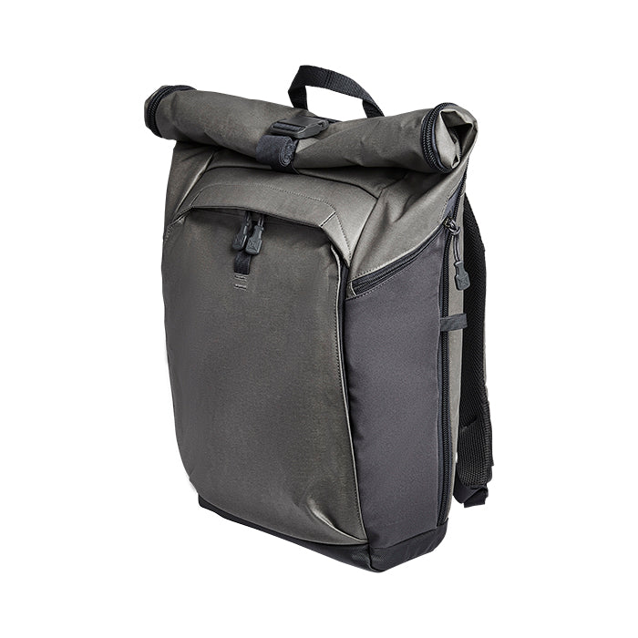 Product shot of a gray and black roll-top backpack featuring adjustable straps, a durable fabric, and sleek zipper pulls against a white background
