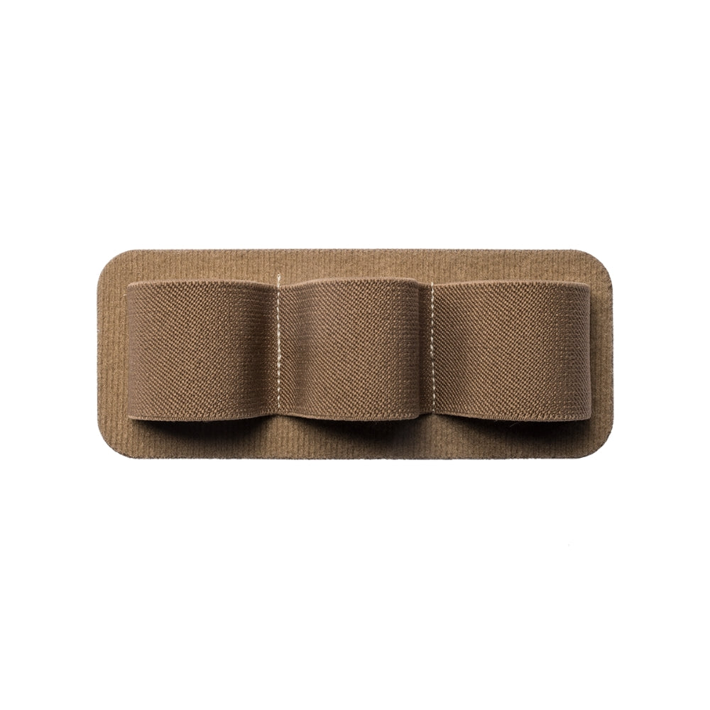 Product shot of a tan textile three-loop utility panel showing a soft, textured fabric with subtle stitching details and a rectangular shape