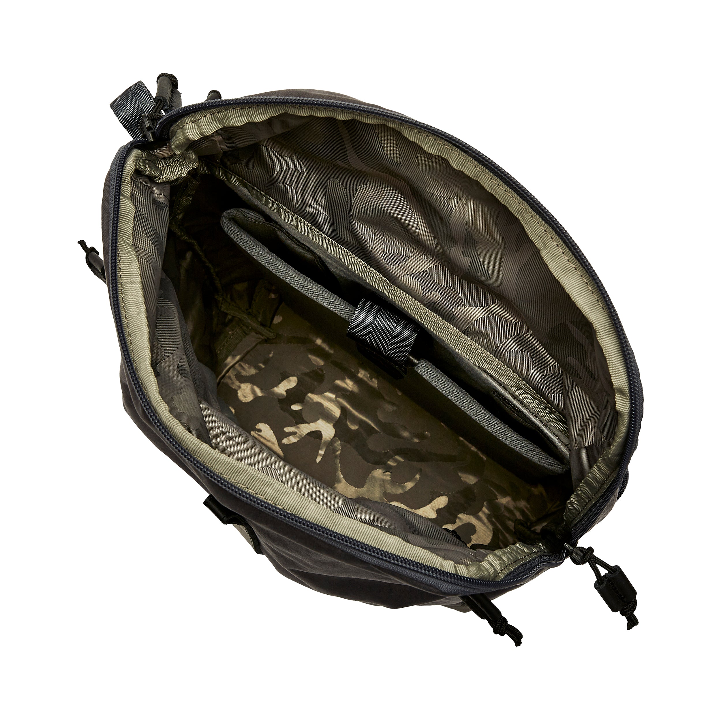 Product shot showing the interior of a dark-grey and olive-green camouflage patterned bag with zipper closure and multiple internal pockets featuring black accents and cord pulls