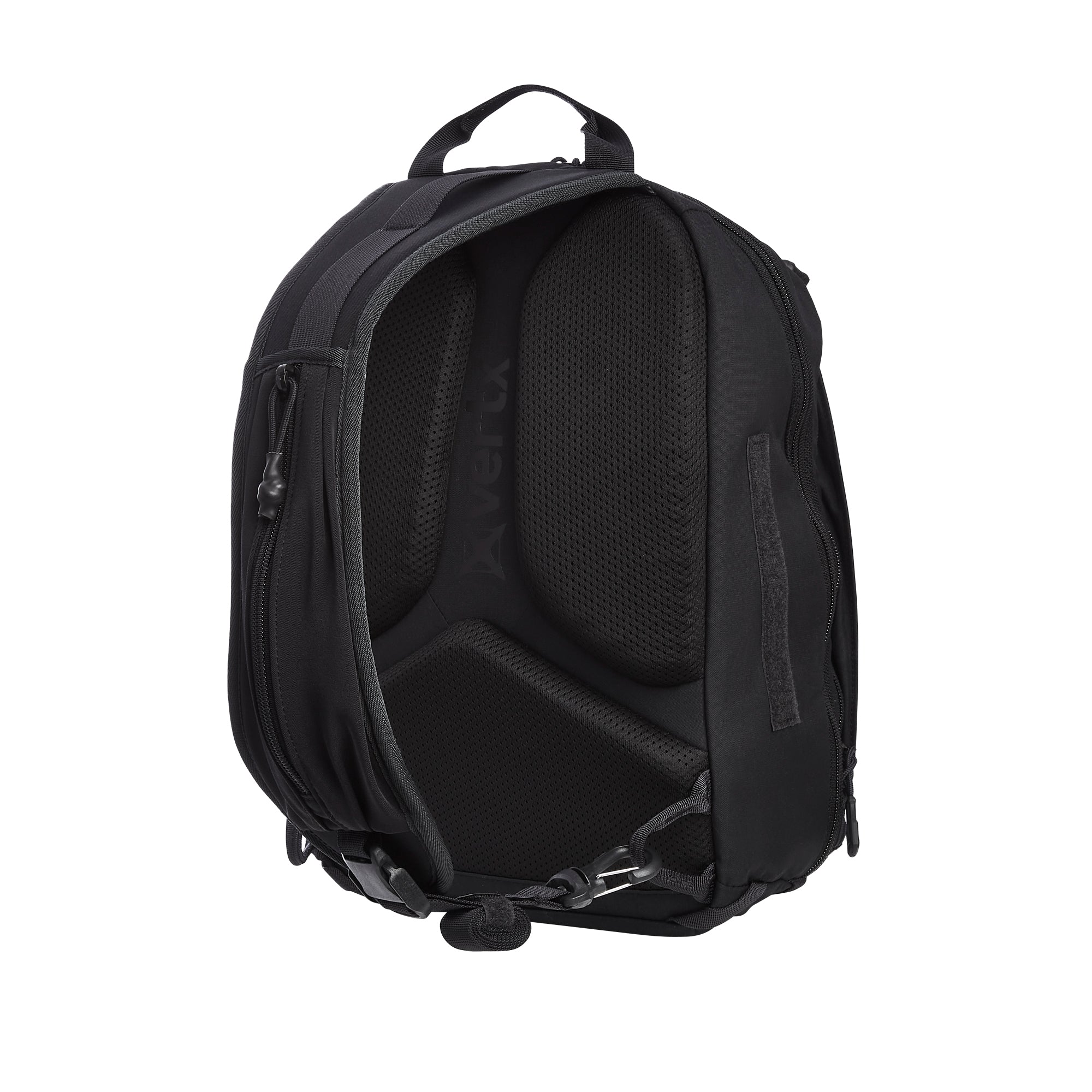 A Vertx black tactical backpack on a white background showcasing its mesh-padded back panel top carry handle and multiple utility zippers and buckles