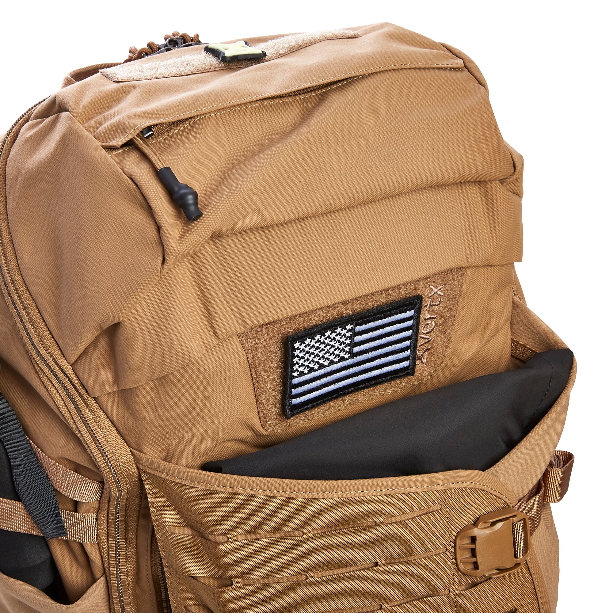 Coyote brown Vertx tactical backpack features a black and white American flag patch an open front pocket with black lining and laser-cut MOLLE webbing