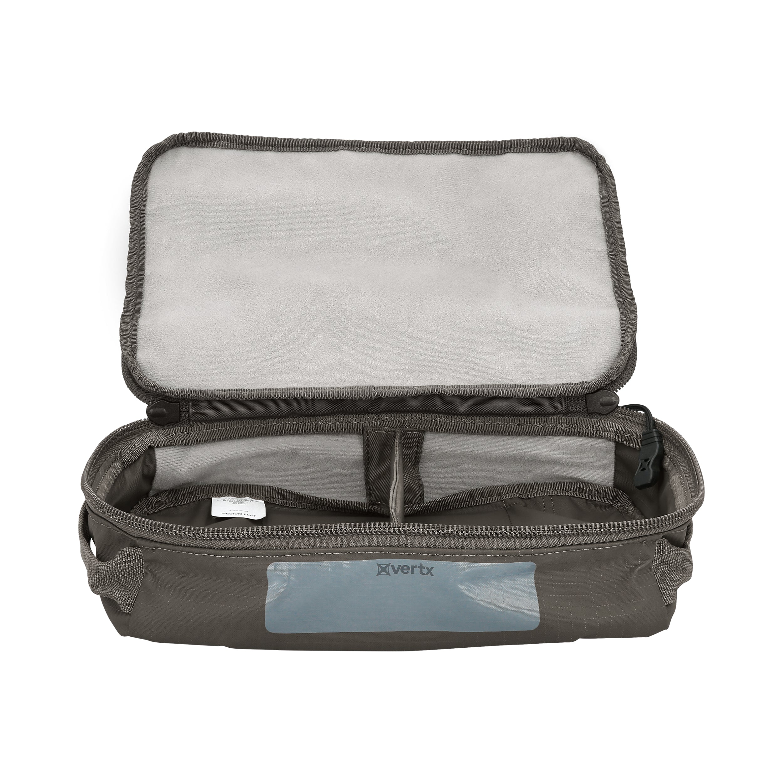 Product shot of a Vertx Medium Flat Pack showing a gray interior with zippered compartments and a light gray, padded top a dark gray exterior and a visible Vertx logo