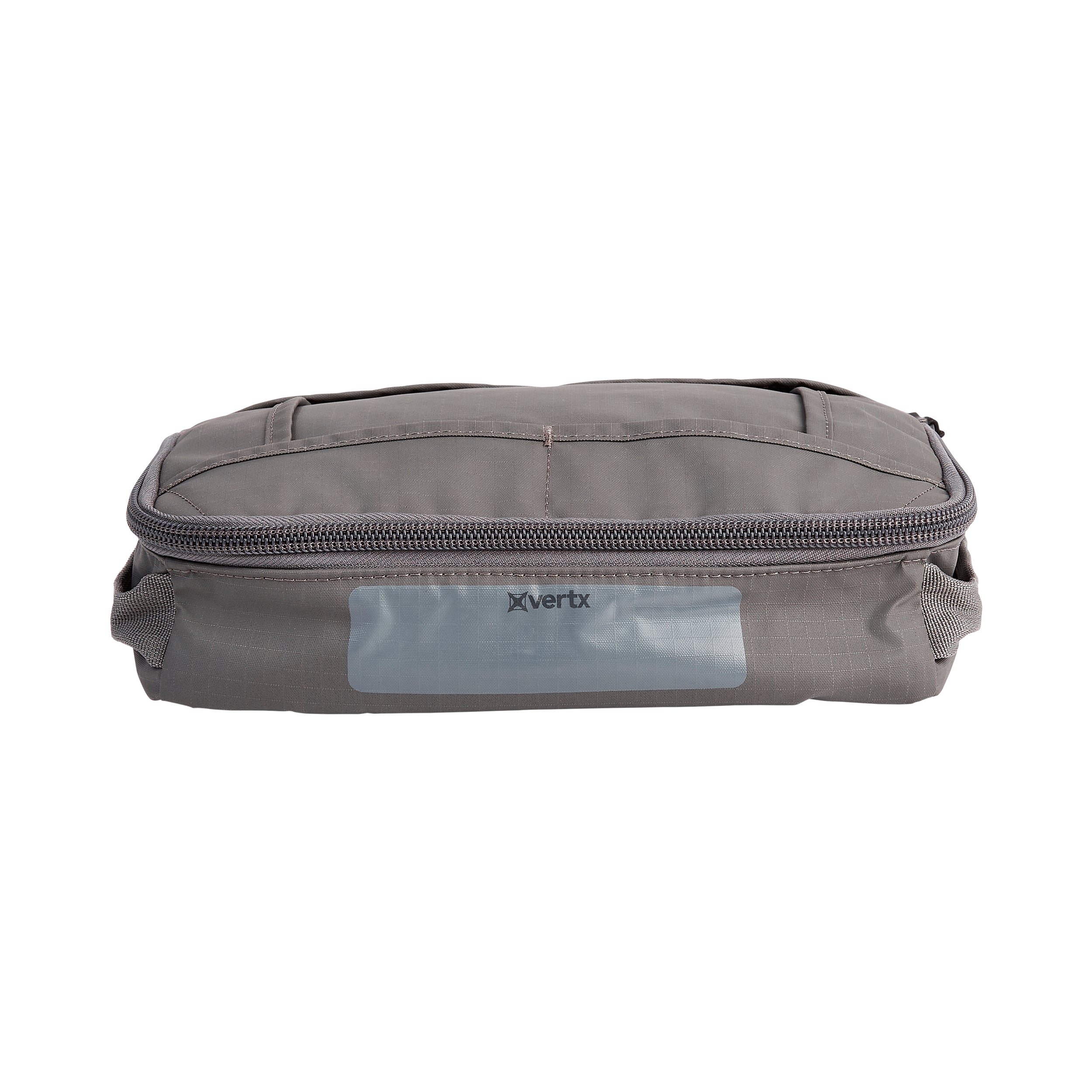 Product shot of a gray Vertx travel bag featuring a zipper closure, textured fabric, and a reflective logo detail