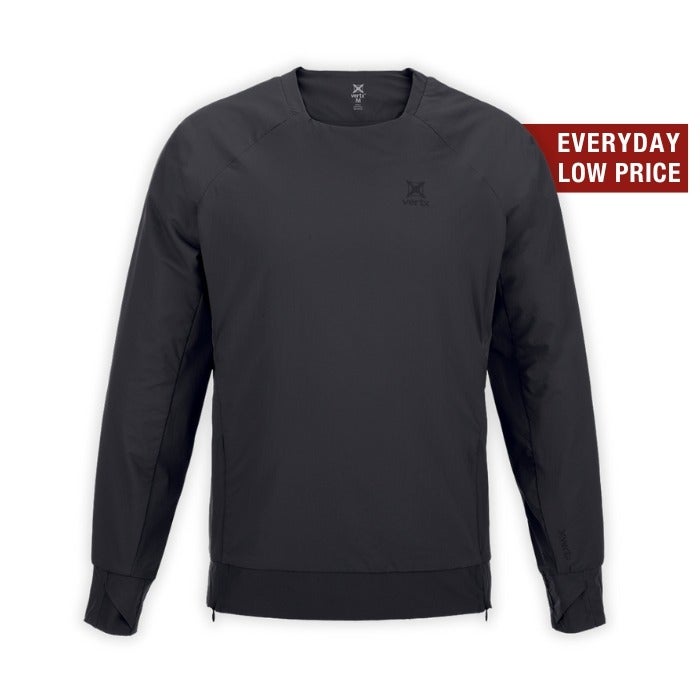Product shot of a dark gray Arc'teryx long-sleeve shirt featuring a minimalist logo, ribbed cuffs, and a subtle zipper detail