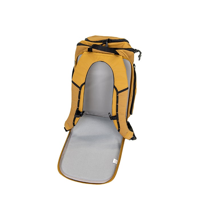 Product photography showing a mustard yellow backpack with black accents and a grey padded interior on a white background