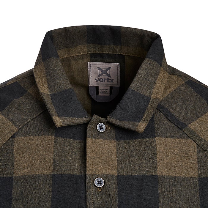 Close-up of a Vertx brand olive and black buffalo plaid flannel shirt showcasing its textured fabric, metal buttons, and a gray woven label