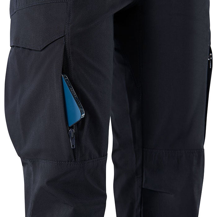 Close-up product shot of black Fjällräven trousers showcasing a zippered pocket with a teal smartphone detailed stitching and reinforced knee patches