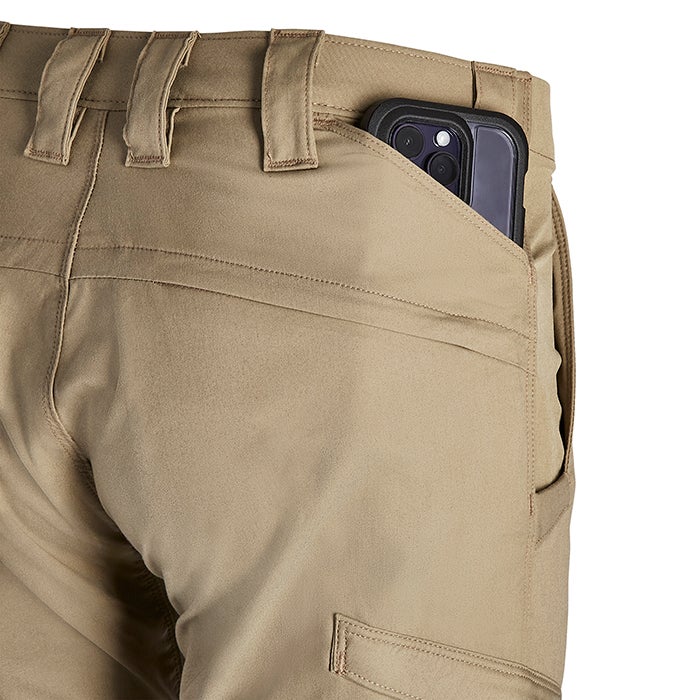 Product shot of tan tactical pants with a smartphone in the back pocket showing reinforced stitching and multiple pockets