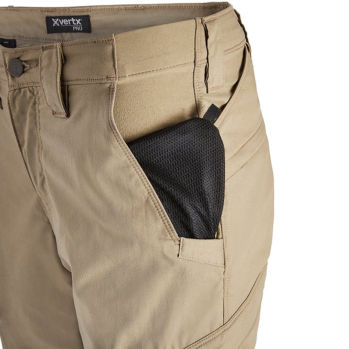 Product shot of Vertx Pro pants showing tan fabric, a black mesh pocket insert, and detailed stitching