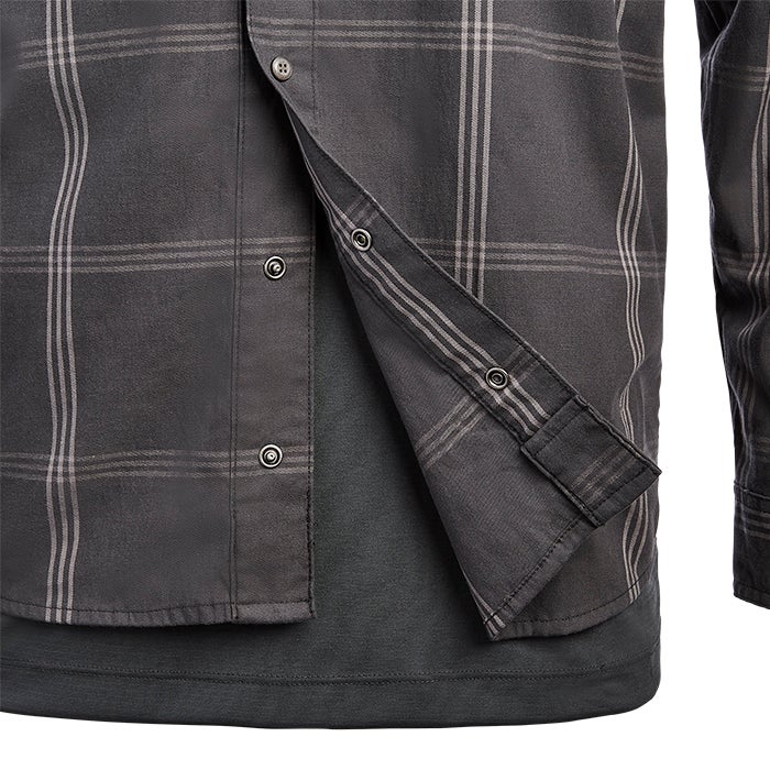 Close-up of a dark gray and light gray plaid long-sleeve shirt showing metal button details a layered look and soft fabric texture