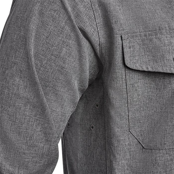 Close-up detail shot of a gray heather long-sleeve shirt showing a chest pocket, arm grommets and textured fabric