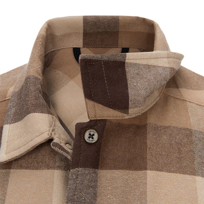 Close-up of a Vertx shirt featuring a beige and brown plaid pattern a button-down collar and a unique branded button showcasing a textured fabric and contrasting color blocking