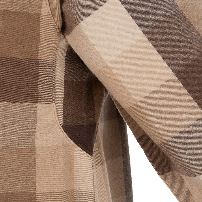 Close-up of a tan and brown plaid cotton shirt showcasing a uniquely shaped pocket and subtle texture variations in the weave