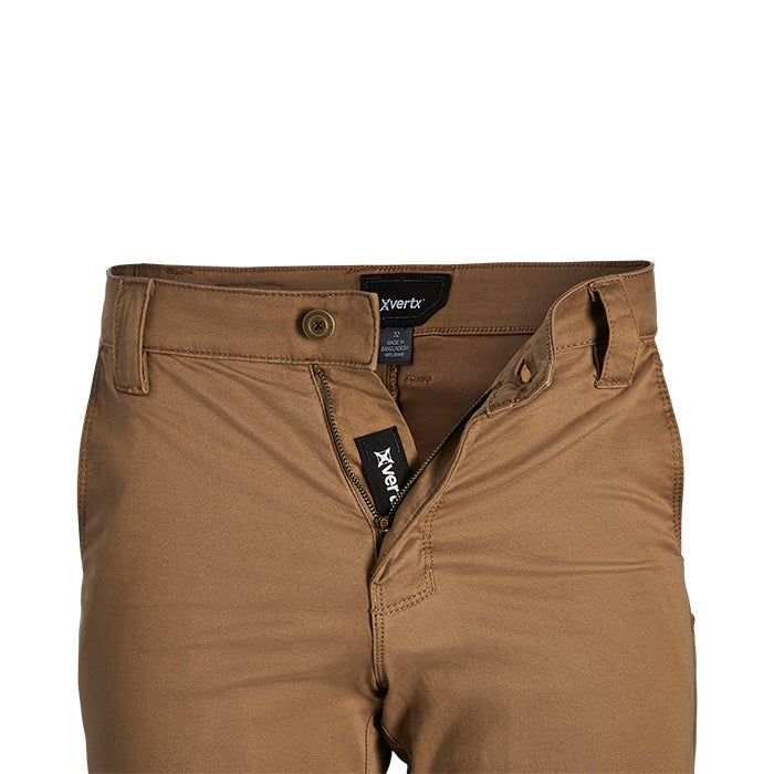 Product shot of Xvertx brown canvas pants showing top button fly zipper and branded tag