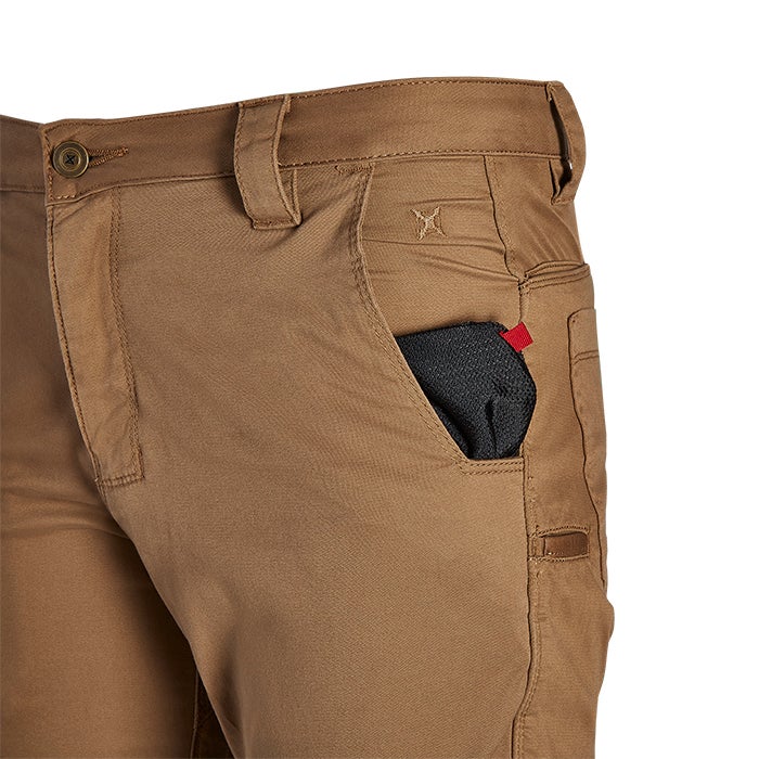 Close-up product shot of brown tactical pants showcasing a small black item in a pocket a red detail and a unique button design