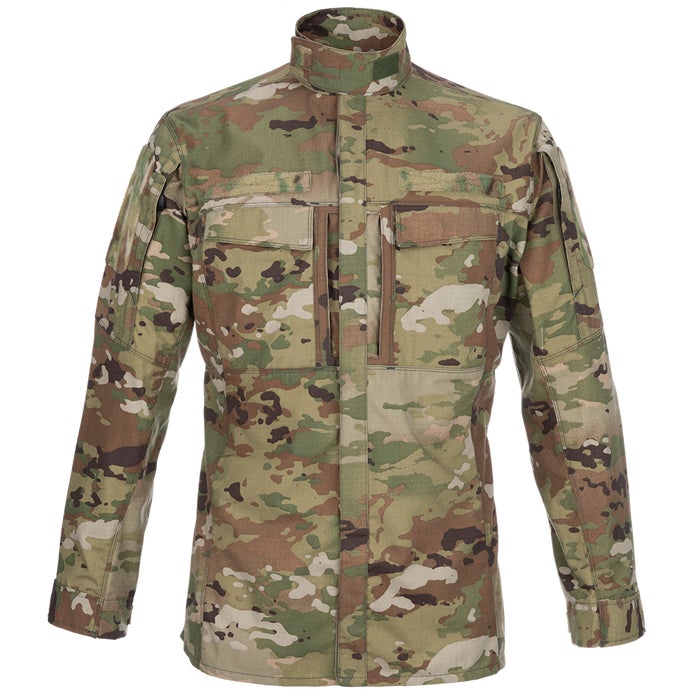 Product shot of a US Army Operational Camouflage Pattern OCP combat uniform shirt featuring a high collar multiple pockets and a detailed camouflage pattern of greens browns and tans