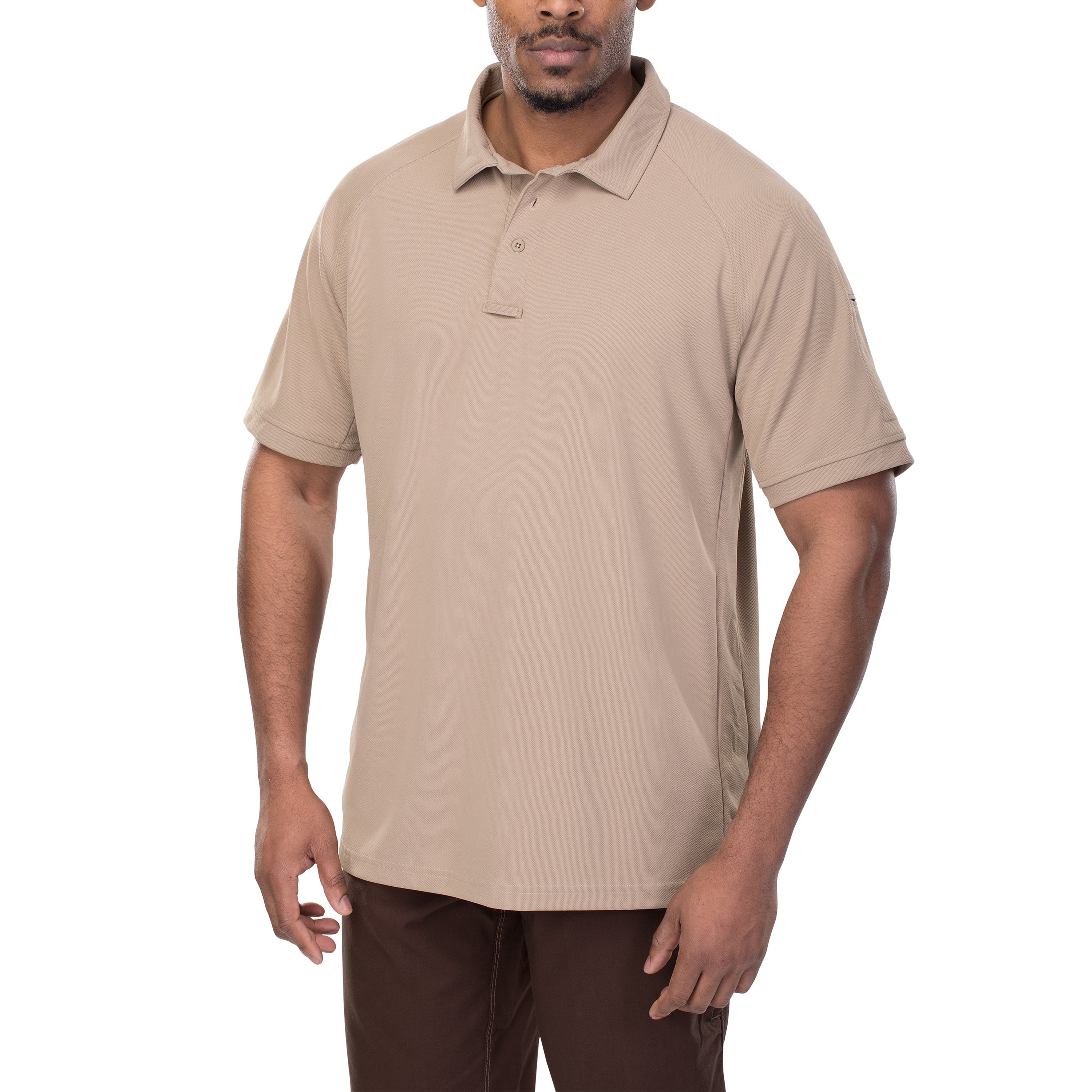 Studio shot of a man modeling a beige short-sleeved polo shirt with a subtle texture and a small pocket on the sleeve, paired with brown pants, against a white background