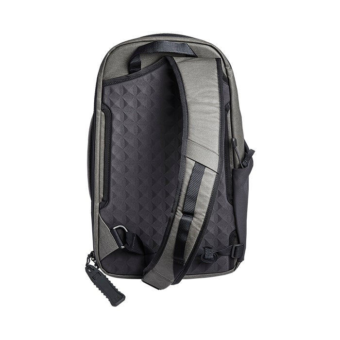 Product shot of a Peak Design Travel Backpack showing its gray and black exterior featuring a geometric patterned back panel padded shoulder straps and a unique zipper pull
