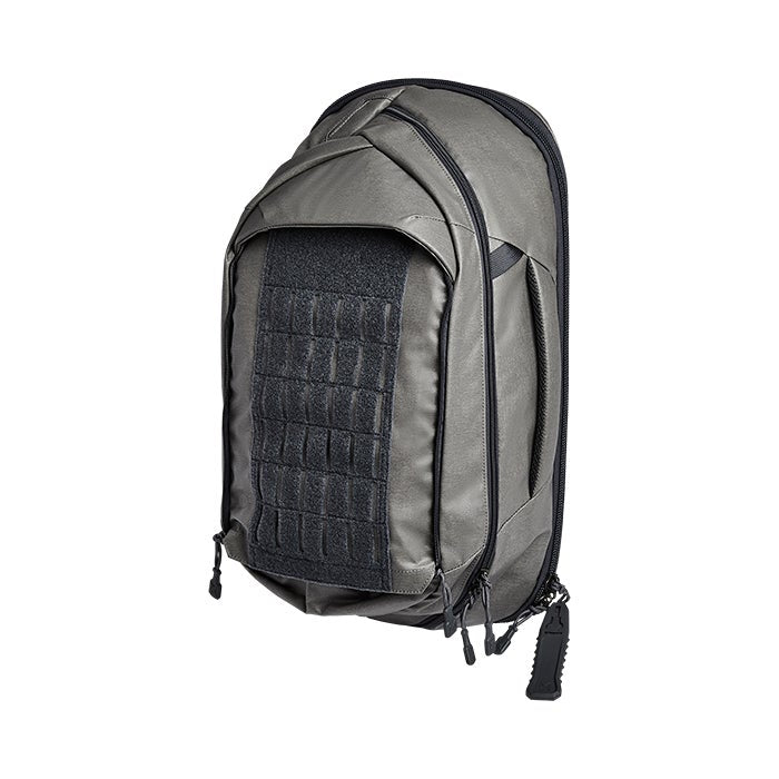 Product shot of a gray and black GoRuck GR1 backpack featuring a MOLLE panel, zippered compartments, and durable construction