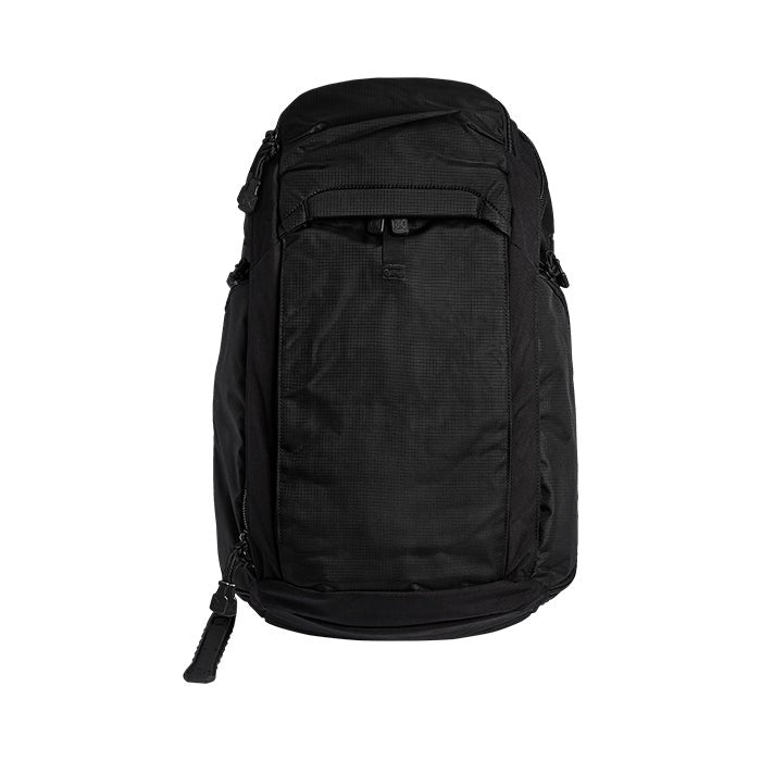 Product shot of a black backpack featuring multiple zippered compartments and a textured fabric surface against a white background