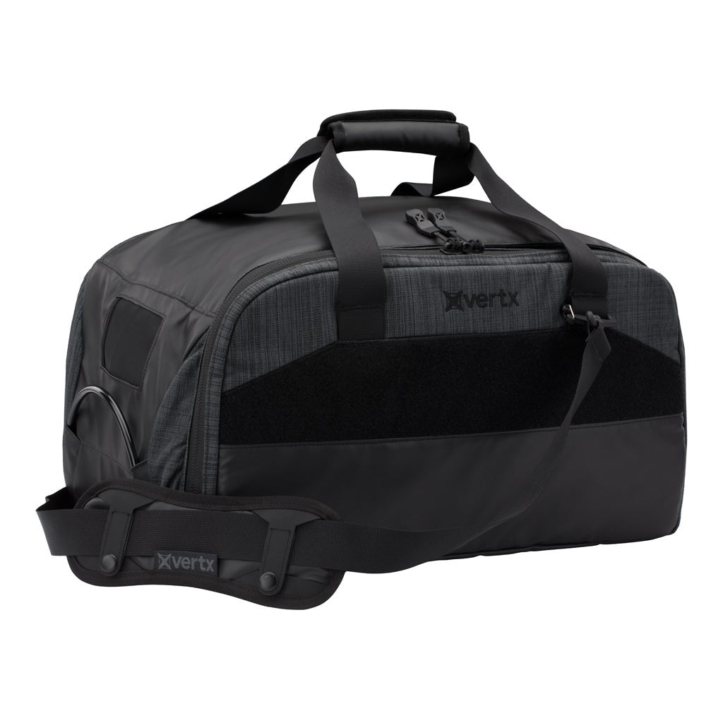 Product shot of a black Xvertx duffel bag with textured fabric a padded handle and additional shoulder strap featuring the brand logo repeated on the bag and strap