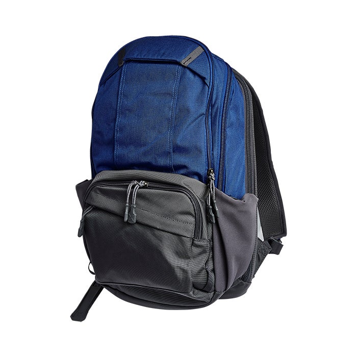 Product shot of a blue and gray backpack featuring multiple zippered compartments and adjustable straps