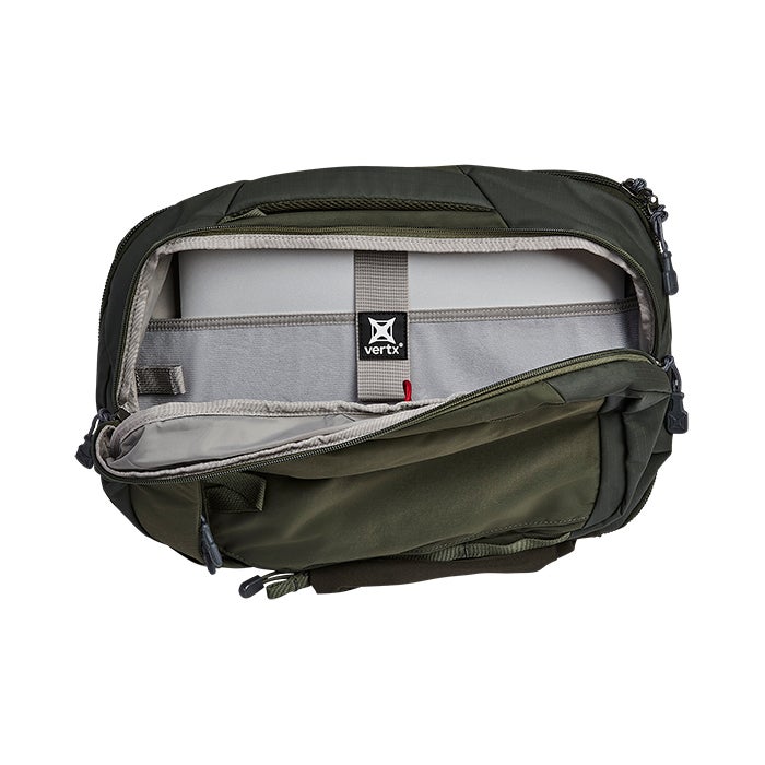 Product shot of a Vertx olive-green laptop bag showing its gray interior padded laptop sleeve and organizational pockets with red accents and a black logo