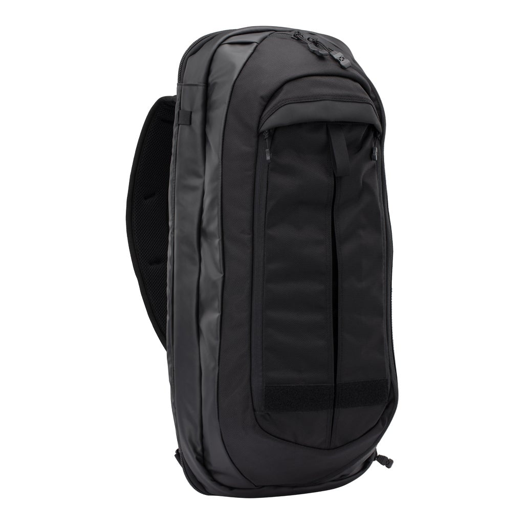 Product shot of a black backpack featuring a large main compartment adjustable straps and multiple zippered pockets showcasing durable fabric and sleek design