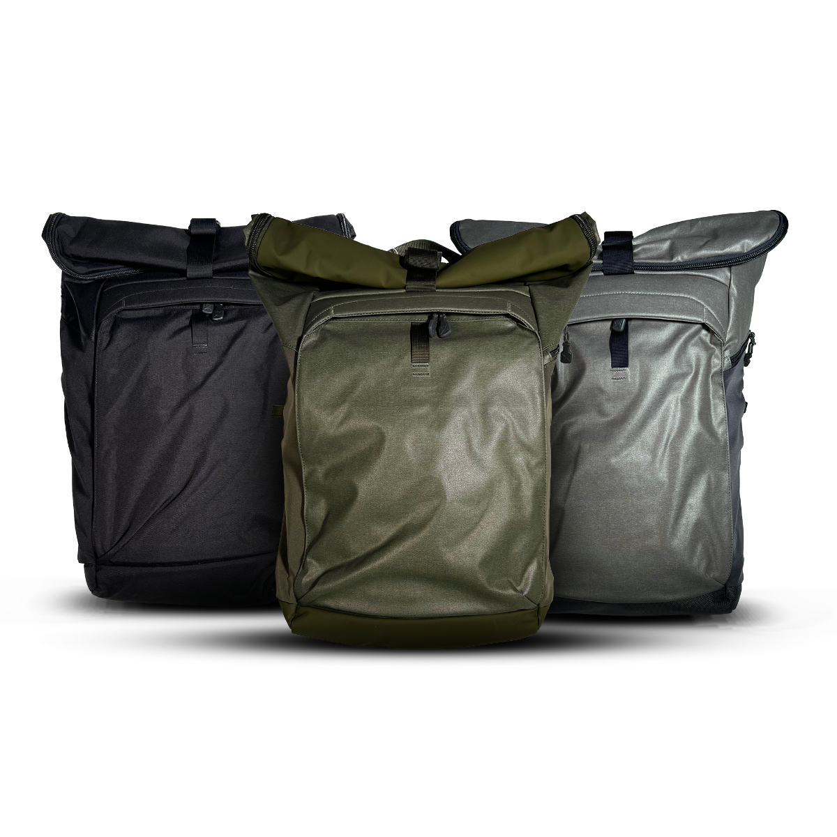 Product shot showing three roll-top backpacks in black olive and gray featuring adjustable straps and zippered pockets against a white background