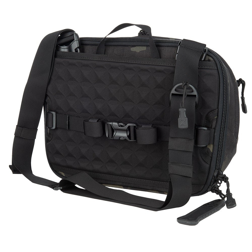 Product photography of a black and camouflage Hill People Gear Kit Bag featuring adjustable straps, geometric textured fabric, and black buckles