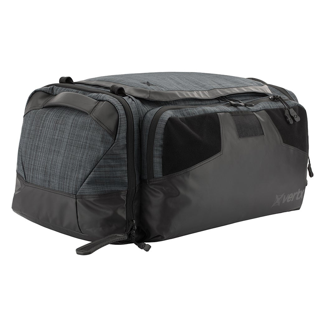 Product shot of a Vertx travel bag featuring a dark gray and black color scheme with zippered compartments and textured fabric