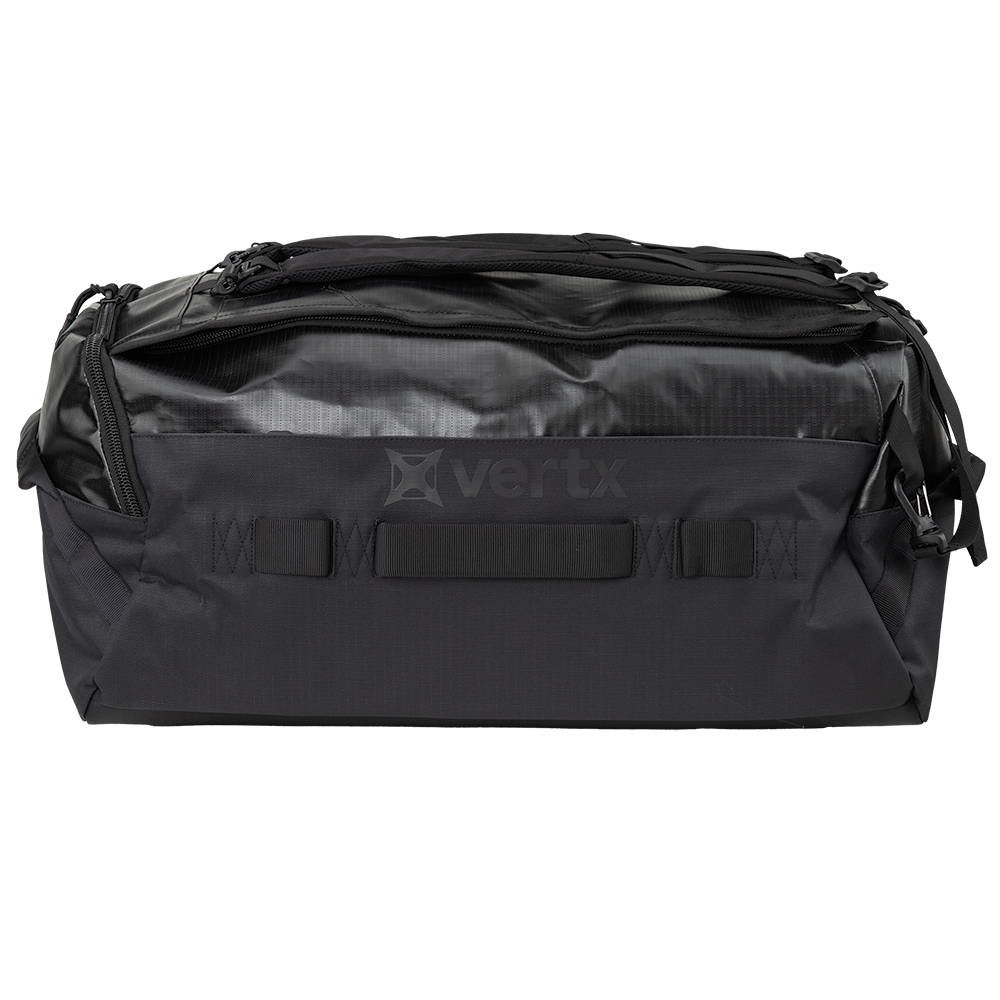 Product shot of a Vertx black duffel bag showing textured fabric top zippered closure and reinforced bottom handle