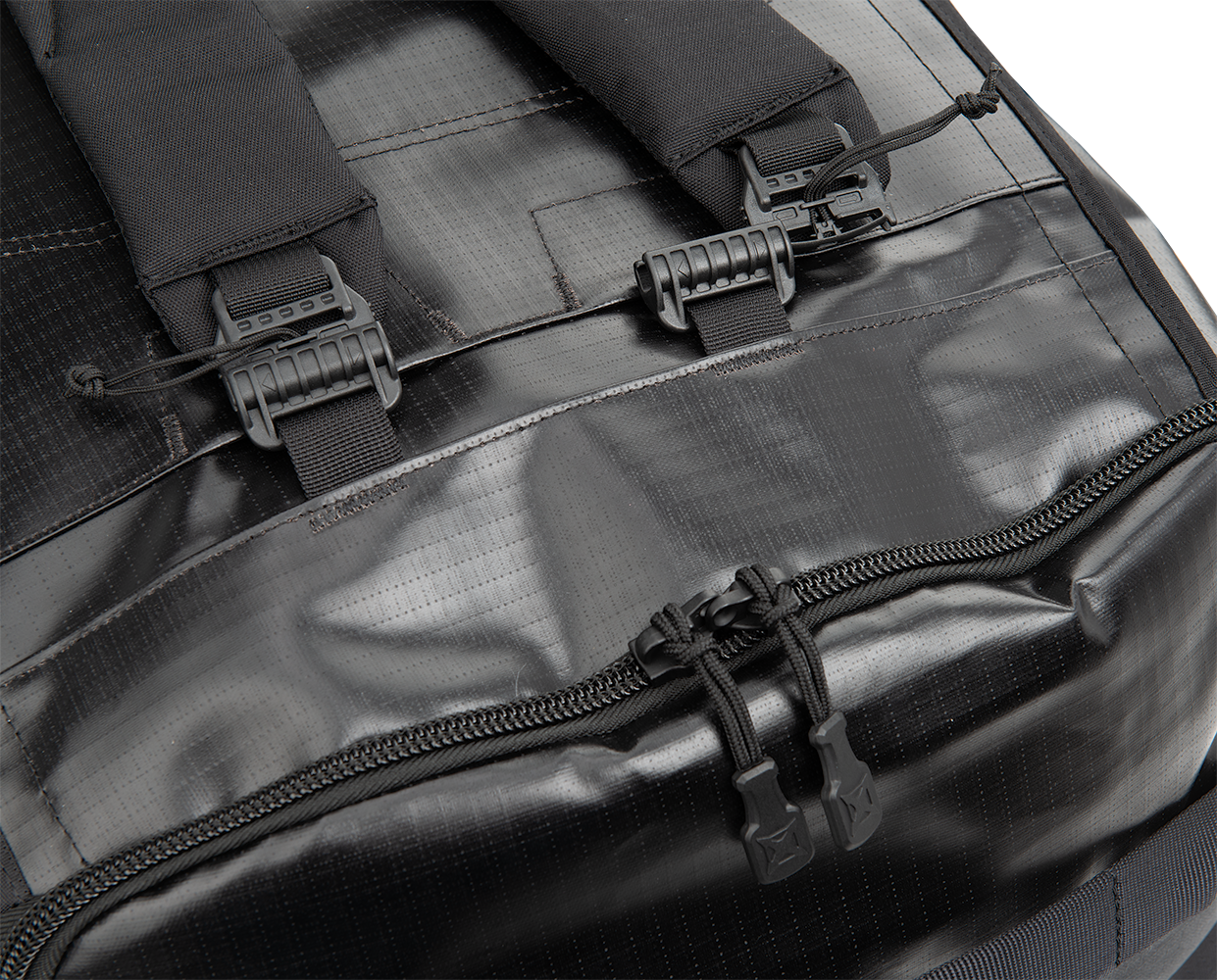 Close-up product shot of a black waterproof backpack featuring adjustable straps, durable zippers, and textured fabric