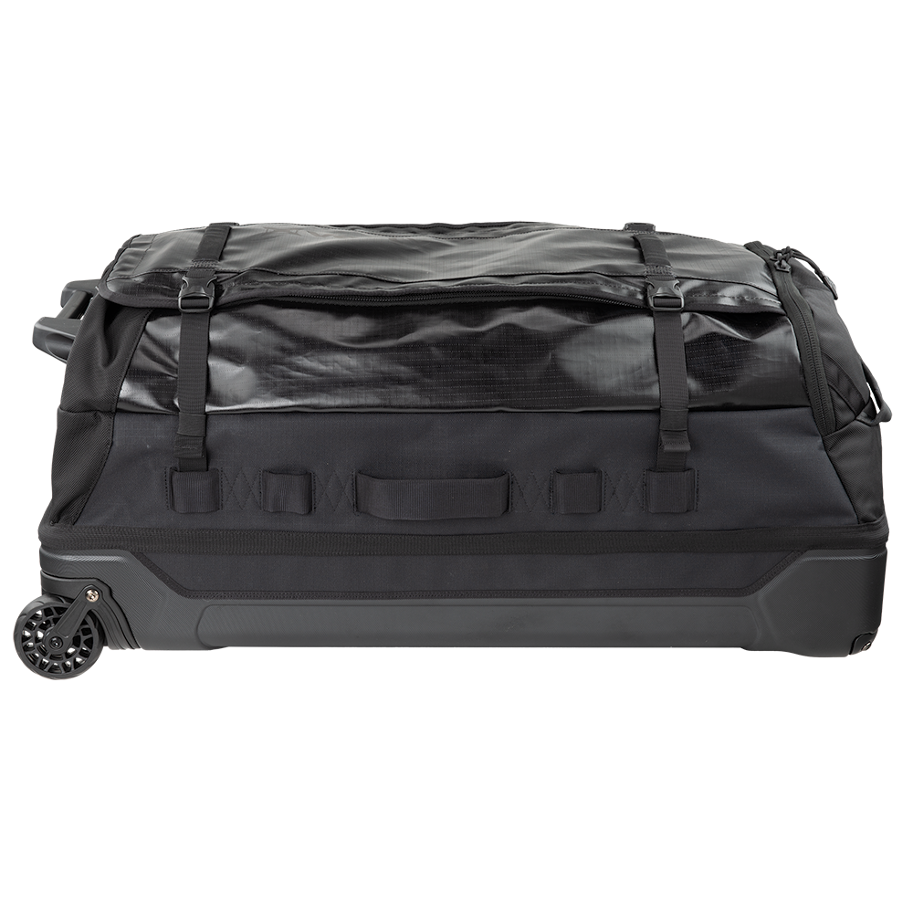 Product shot of a black wheeled duffel bag featuring compression straps, multiple grab handles and a durable wheel system
