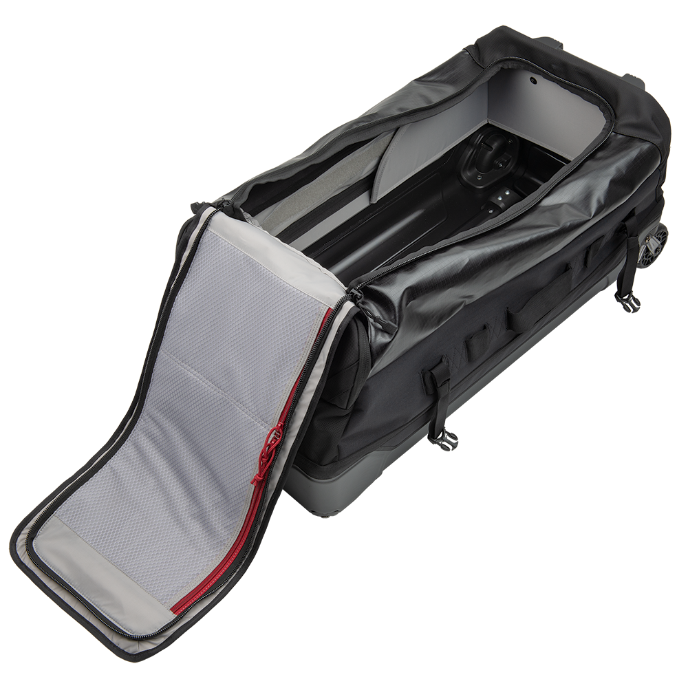 Product shot of a black wheeled duffel bag with gray interior and red zipper detailing showing a spacious main compartment and organizational pockets