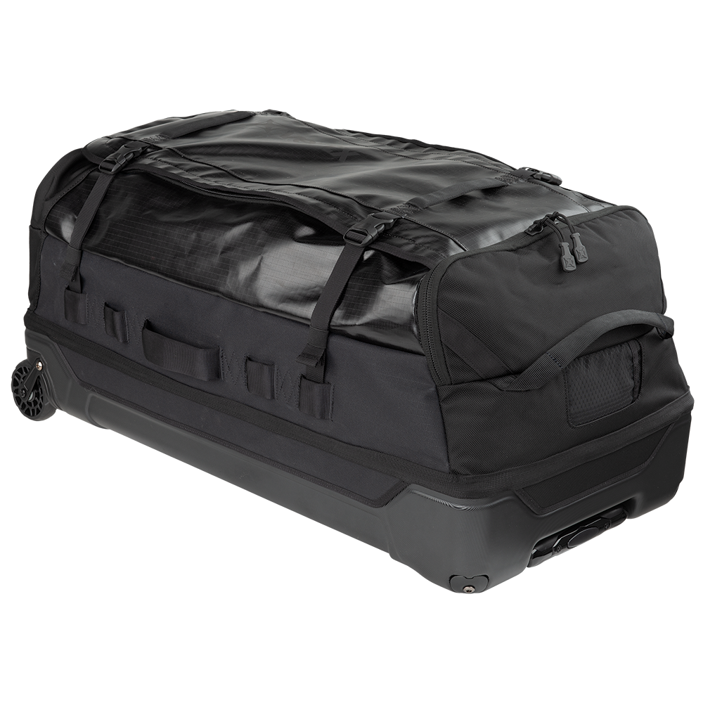 Product shot of a black wheeled duffel bag featuring reinforced straps and a textured top panel with durable zippers and a padded handle