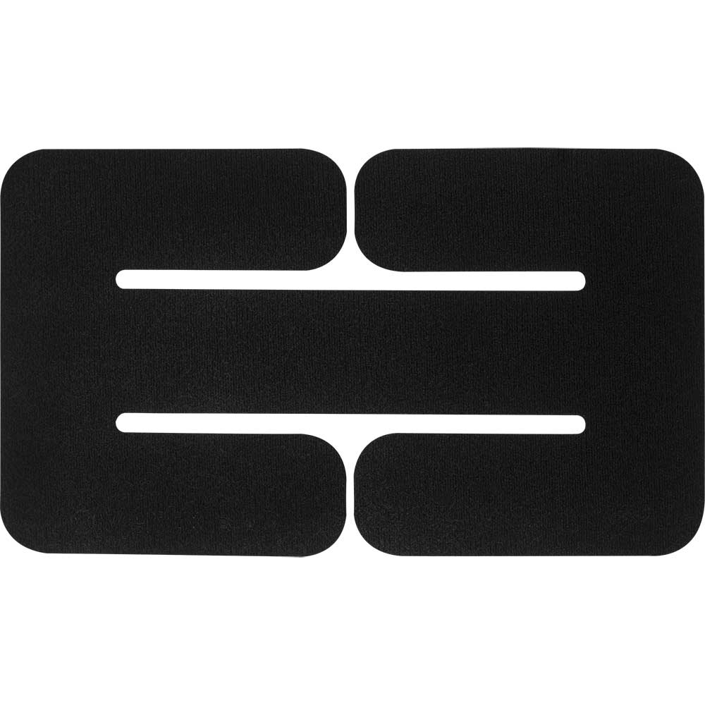 Black fabric abstract design showing a textured surface with cutouts forming geometric shapes and negative space