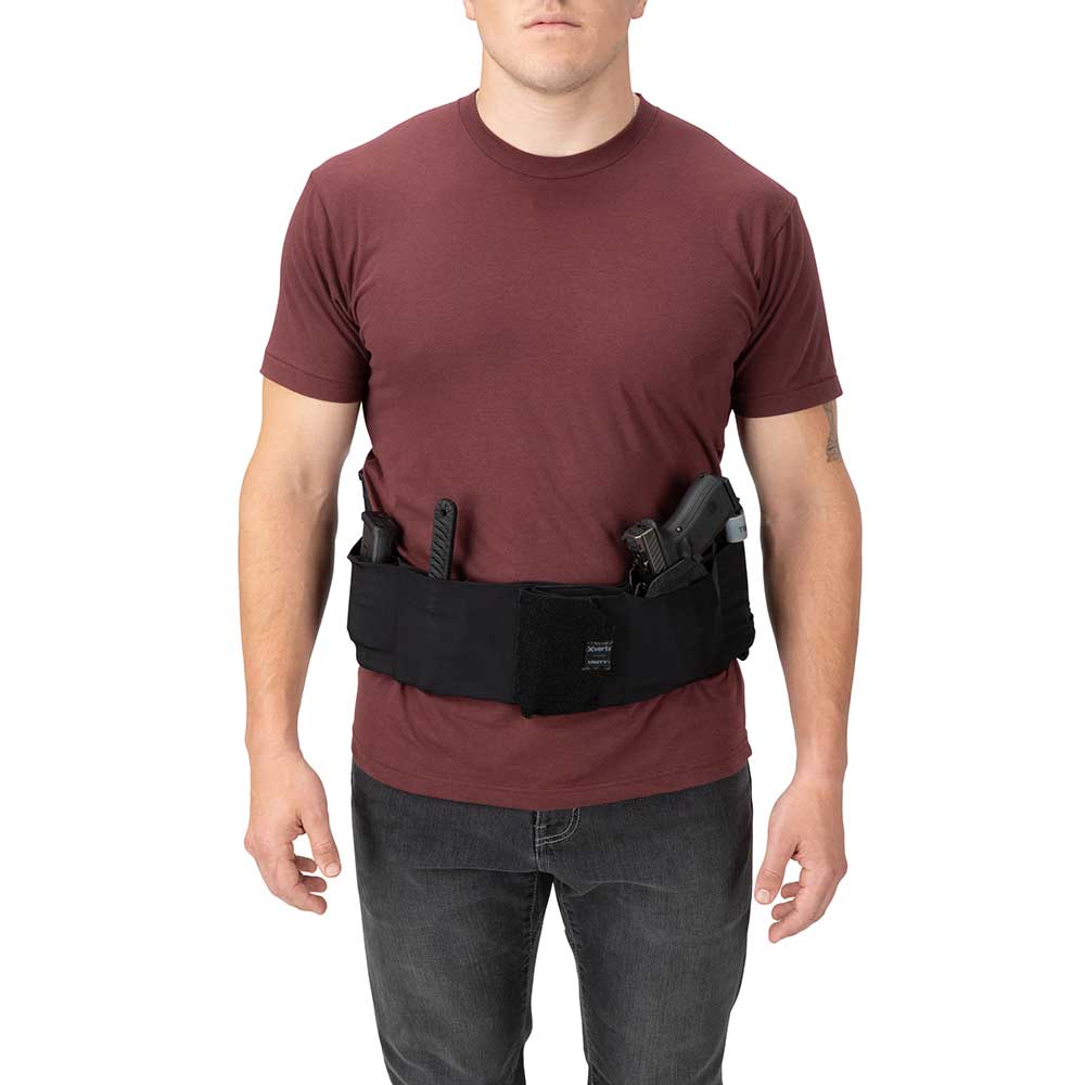 Product shot showing a person wearing a black tactical belt with a handgun, knife, and dark maroon shirt against a white background