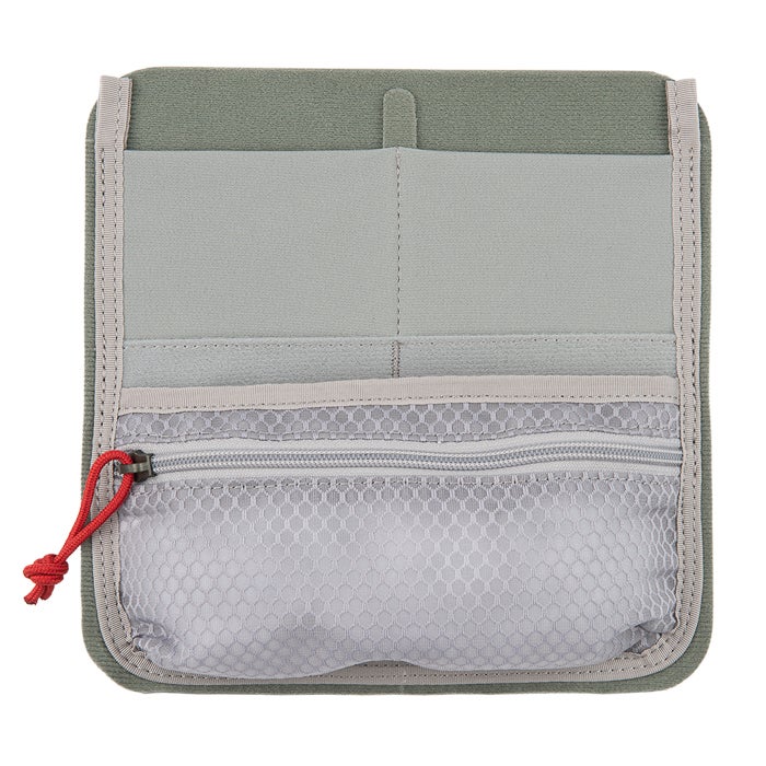 Product shot of a sage green and gray fabric organizer with multiple compartments a zippered mesh pocket and red pull tab