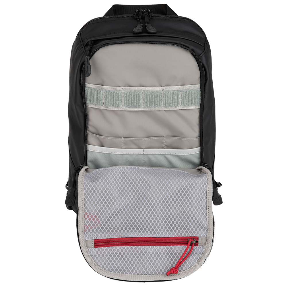 Product shot of a black sling bag showing its interior compartments including gray fabric straps, a white zippered pocket and a red zippered mesh pocket