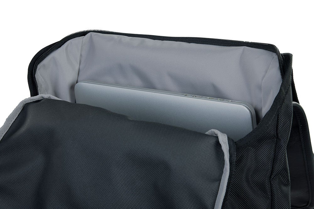 Product shot showing a black laptop backpack with a gray padded laptop sleeve a silver laptop inside and a zipper detail