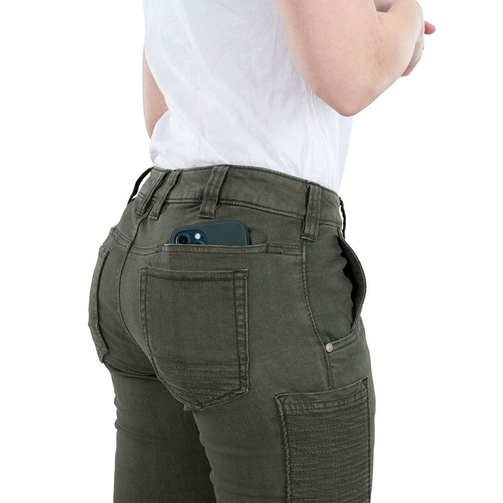 Product shot showing a smartphone in a dark green phone case in the back pocket of olive green jeans featuring contrasting stitching and rivets